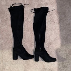 Never worn, black mid thigh high boots with heel.